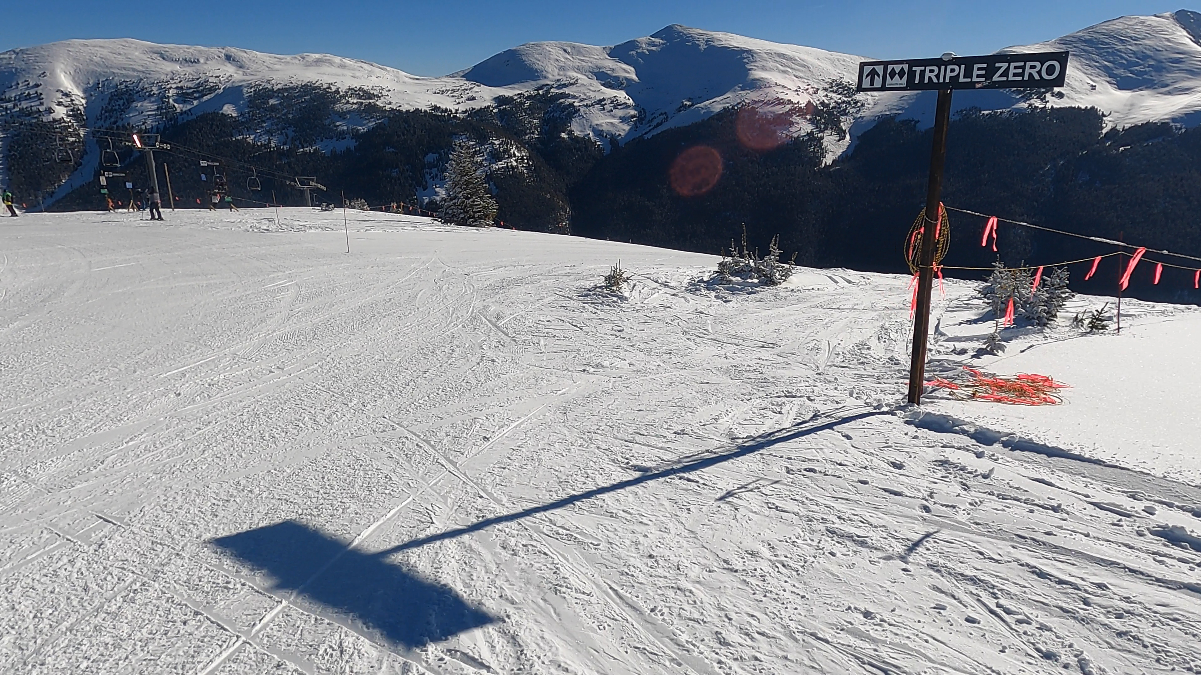 Skier preparing to enter a steep in-bounds slope at a North American resort
